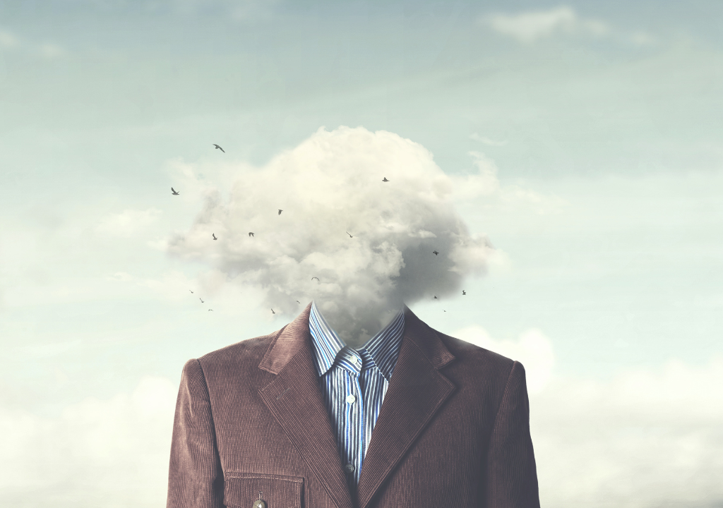 Homem de terno com cabeça de nuvem e pássaros voando, simbolizando estresse e saúde mental